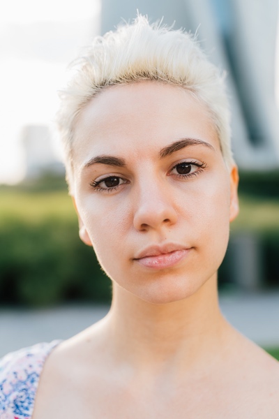 Confident woman outdoors with natural light